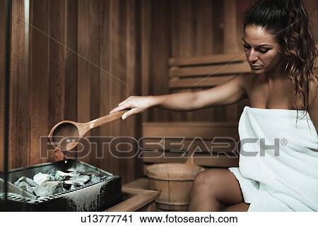 Woman relaxing in sauna View Large Photo Image Stock Image - Woman relaxing in sauna. Fotosearch
