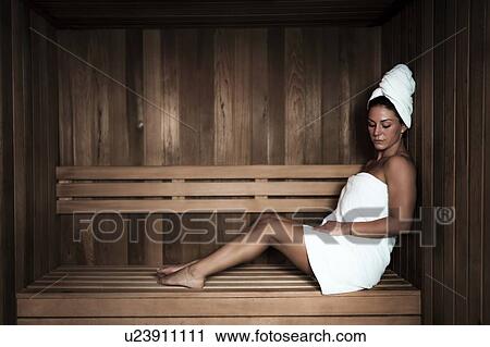 Woman relaxing in sauna View Large Photo Image Stock Image - Woman relaxing in sauna. Fotosearch
