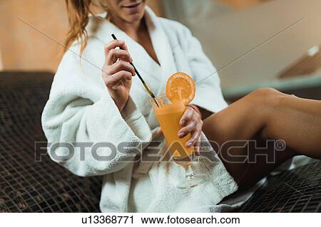 Woman relaxing on a warm tepidarium bed in a spa View Large Photo Image Stock Image - Woman relaxing on a warm tepidarium bed in a spa. Fotosearch