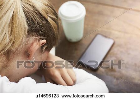 Stock Image - Woman resting at coffee break. Fotosearch