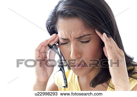 Woman rubbing her temples View Large Photo Image Stock Image - Woman rubbing her temples. Fotosearch