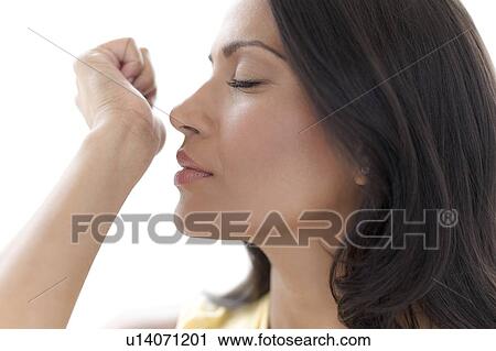 Woman smelling perfume on her wrist View Large Photo Image Stock Image - Woman smelling perfume on her wrist. Fotosearch