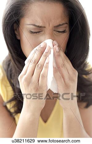 Stock Photo - Woman sneezing. Fotosearch