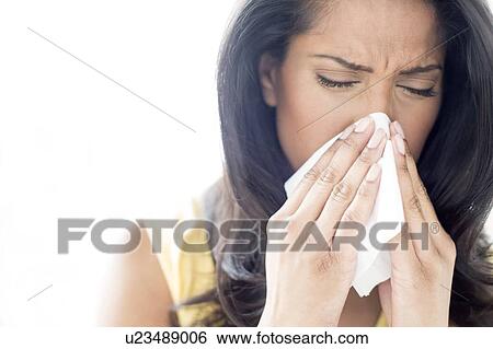 Stock Photograph - Woman sneezing. Fotosearch
