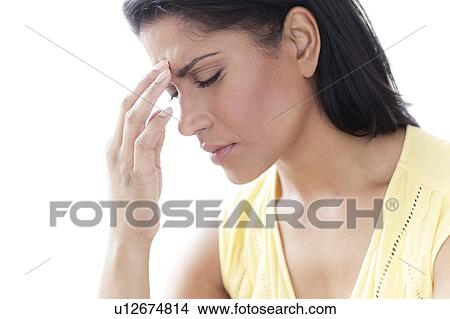 Woman touching her head in pain View Large Photo Image Picture - Woman touching her head in pain. Fotosearch