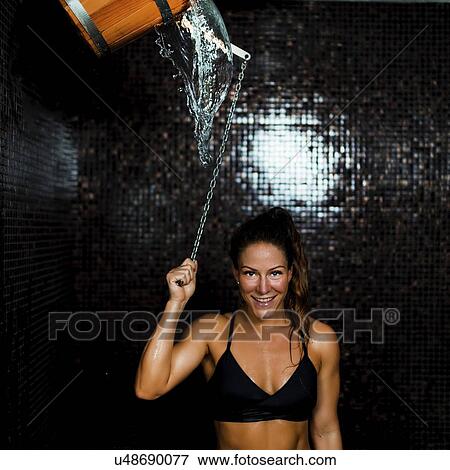 Woman under ice cold shower bucket View Large Photo Image Stock Photo - Woman under ice cold shower bucket. Fotosearch