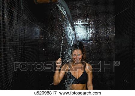 Woman under ice cold shower bucket View Large Photo Image Stock Photo - Woman under ice cold shower bucket. Fotosearch