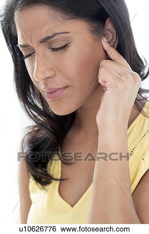 Stock Photograph - Woman with ear pain. Fotosearch