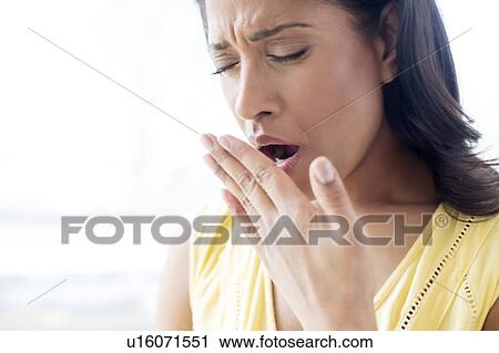 Stock Image - Woman yawning. Fotosearch