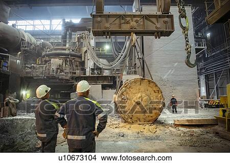 Workers arranging crane lines in steelworks View Large Photo Image Picture - Workers arranging crane lines in steelworks. Fotosearch