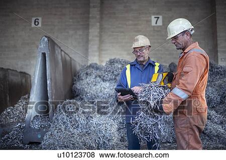 Workers checking and testing titanium swarf waste in titanium recycling plant View Large Photo Image Stock Photo - Workers checking and testing titanium swarf waste in titanium recycling plant. Fotosearch