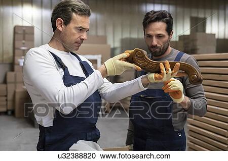 Workers inspecting woodwork in factory View Large Photo Image Stock Image - Workers inspecting woodwork in factory. Fotosearch