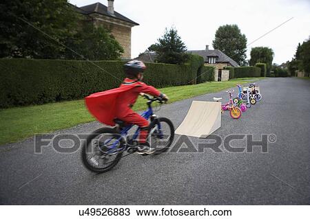 Young bike stunt performer View Large Photo Image Stock Image - Young bike stunt performer. Fotosearch