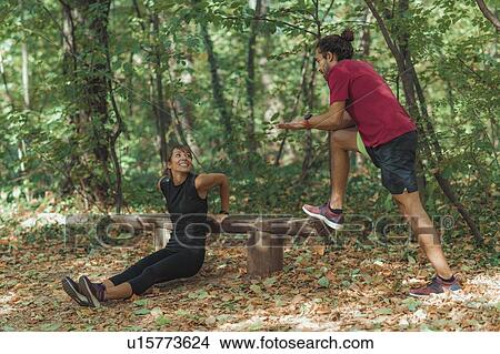 Young couple exercising outdoors View Large Photo Image Picture - Young couple exercising outdoors. Fotosearch