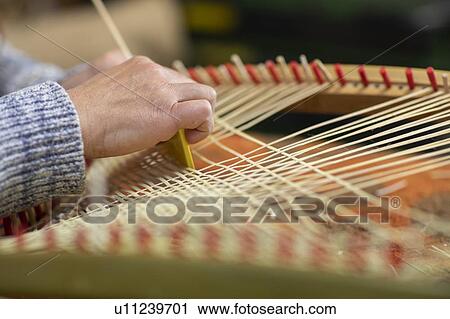 Young female basket maker weaving in workshop, close up of hands View Large Photo Image Stock Image - Young female basket maker weaving in workshop, close up of hands. Fotosearch
