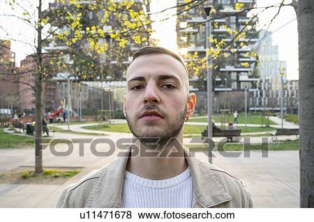 Stock Photo - Young man in city, Milano, Lombardia, Italy. Fotosearch