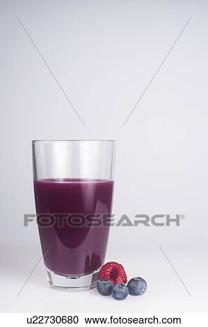 A glass of fresh juice made with mixed berries View Large Photo Image Stock Image - A glass of fresh juice made with mixed berries. Fotosearch