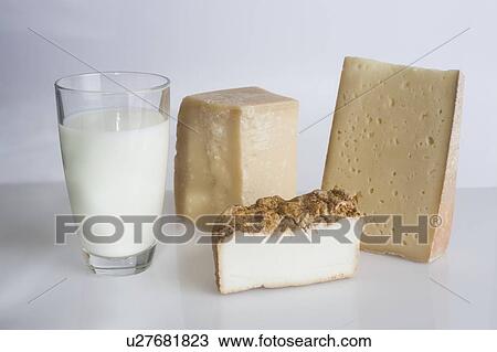 Stock Image - A glass of milk and cheeses. Fotosearch