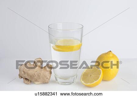 A glass of water with fresh lemon slices and ginger View Large Photo Image Stock Image - A glass of water with fresh lemon slices and ginger. Fotosearch