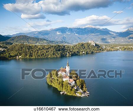 Aerial view of Bled Island with Church of the Assumption at dawn, Lake Bled, Upper Carniola, Slovenia View Large Photo Image Stock Photo - Aerial view of Bled Island with Church of the Assumption at dawn, Lake Bled, Upper Carniola, Slovenia. Fotosearch