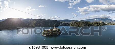 Aerial view of Bled Island with Church of the Assumption at dawn, Lake Bled, Upper Carniola, Slovenia View Large Photo Image Stock Photography - Aerial view of Bled Island with Church of the Assumption at dawn, Lake Bled, Upper Carniola, Slovenia. Fotosearch
