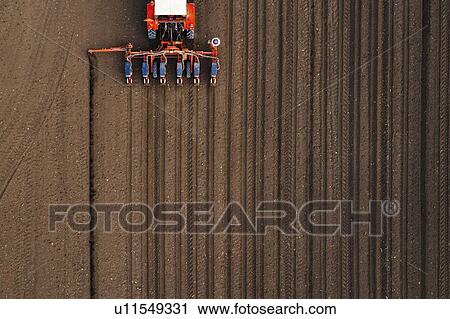 Aerial view of tractor with mounted seeder View Large Photo Image Stock Image - Aerial view of tractor with mounted seeder. Fotosearch