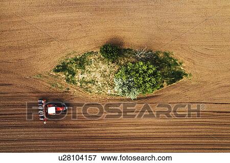 Aerial view of tractor with seeder View Large Photo Image Stock Photo - Aerial view of tractor with seeder. Fotosearch