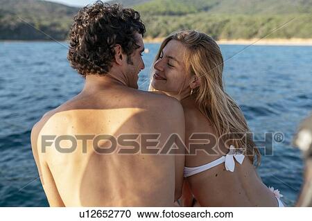 Affectionate couple by seaside, Italy View Large Photo Image Stock Image - Affectionate couple by seaside, Italy. Fotosearch