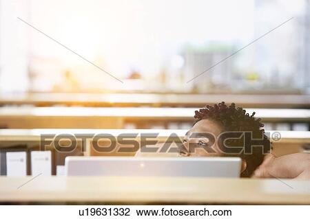 African American Man using computer in office with relaxing View Large Photo Image Stock Image - African American Man using computer in office with relaxing. Fotosearch