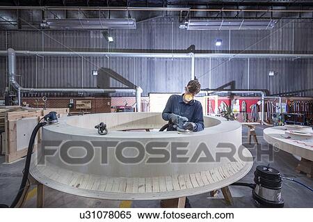 Apprentice working on wooden mould in steelworks View Large Photo Image Stock Photography - Apprentice working on wooden mould in steelworks. Fotosearch