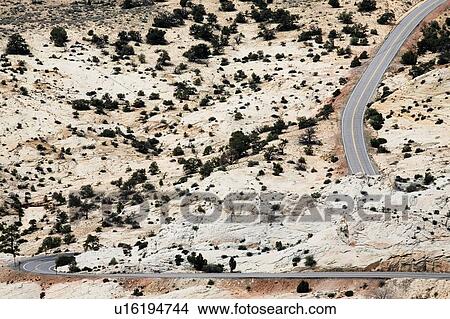Arid winding desert motorway highway View Large Photo Image Picture - Arid winding desert motorway highway. Fotosearch