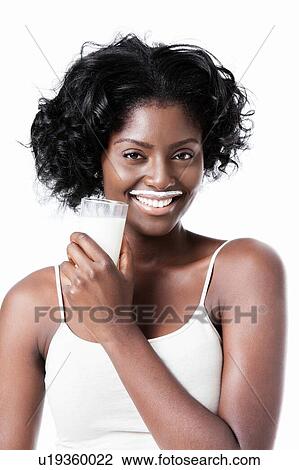 Attractive black woman drinking milk with milk moustache View Large Photo Image Stock Image - Attractive black woman drinking milk with milk moustache. Fotosearch
