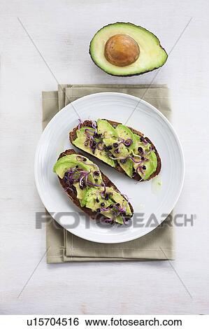 Avocado on toast with sprouts View Large Photo Image Stock Photograph - Avocado on toast with sprouts. Fotosearch