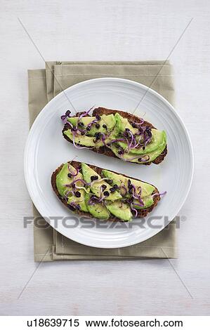 Avocado on toast with sprouts View Large Photo Image Stock Photography - Avocado on toast with sprouts. Fotosearch