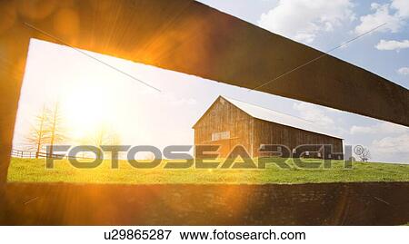 Barn in field with fence View Large Photo Image Stock Photo - Barn in field with fence. Fotosearch