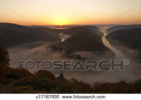 Big Loop of Saar River in autumn, Mettlach, Saar Valley, Saarland, Germany View Large Photo Image Stock Image - Big Loop of Saar River in autumn, Mettlach, Saar Valley, Saarland, Germany. Fotosearch