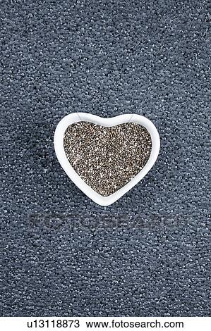 Black chia seeds in heart shaped dish View Large Photo Image Stock Image - Black chia seeds in heart shaped dish. Fotosearch