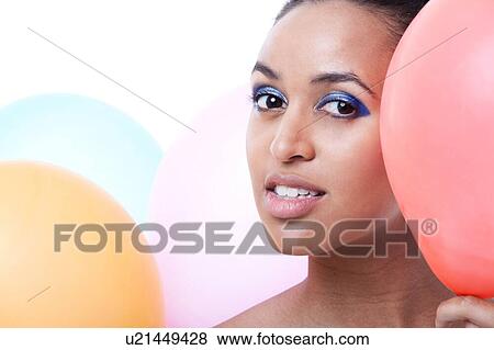 Black female hiding behind balloons View Large Photo Image Stock Photo - Black female hiding behind balloons. Fotosearch
