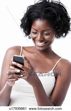 Stock Image - Black female using smartphone. Fotosearch