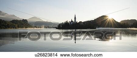 Bled Island with Church of the Assumption at dawn, Lake Bled, Upper Carniola, Slovenia View Large Photo Image Picture - Bled Island with Church of the Assumption at dawn, Lake Bled, Upper Carniola, Slovenia. Fotosearch