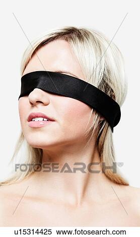 Blonde woman wearing blindfold View Large Photo Image Stock Photography - Blonde woman wearing blindfold. Fotosearch