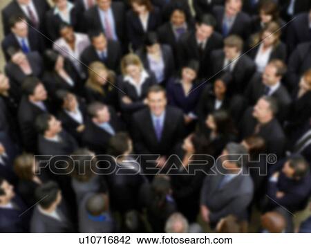 Stock Image - Blurred photo of business group crowd. Fotosearch