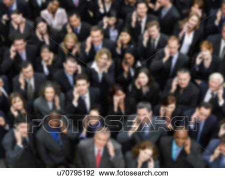 Stock Image - Blurred photo of business group crowd. Fotosearch