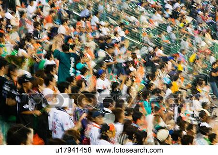 Blurred photo of Fans in football stadium View Large Photo Image Stock Photo - Blurred photo of Fans in football stadium. Fotosearch