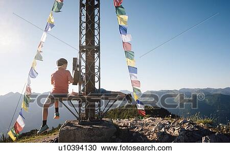 Stock Image - Boy enjoying view on peak, Bludenz, Vorarlberg, Austria. Fotosearch