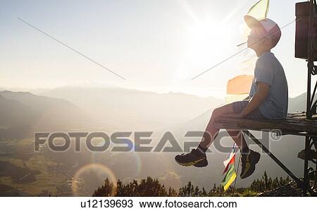 Boy enjoying view on peak, Bludenz, Vorarlberg, Austria View Large Photo Image Stock Image - Boy enjoying view on peak, Bludenz, Vorarlberg, Austria. Fotosearch