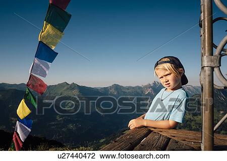 Boy enjoying view on peak, Bludenz, Vorarlberg, Austria View Large Photo Image Stock Image - Boy enjoying view on peak, Bludenz, Vorarlberg, Austria. Fotosearch