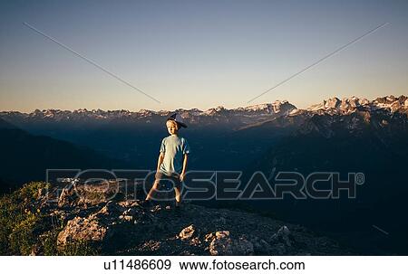 Boy enjoying view on peak, Bludenz, Vorarlberg, Austria View Large Photo Image Stock Photo - Boy enjoying view on peak, Bludenz, Vorarlberg, Austria. Fotosearch