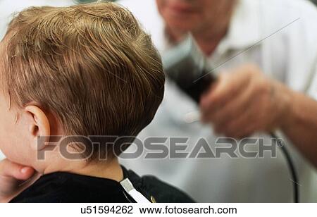Boy having hair shaved in barbers View Large Photo Image Stock Image - Boy having hair shaved in barbers. Fotosearch