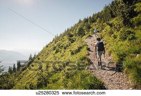 Stock Photography - Boy hiking on trail, Bludenz, Vorarlberg, Austria. Fotosearch